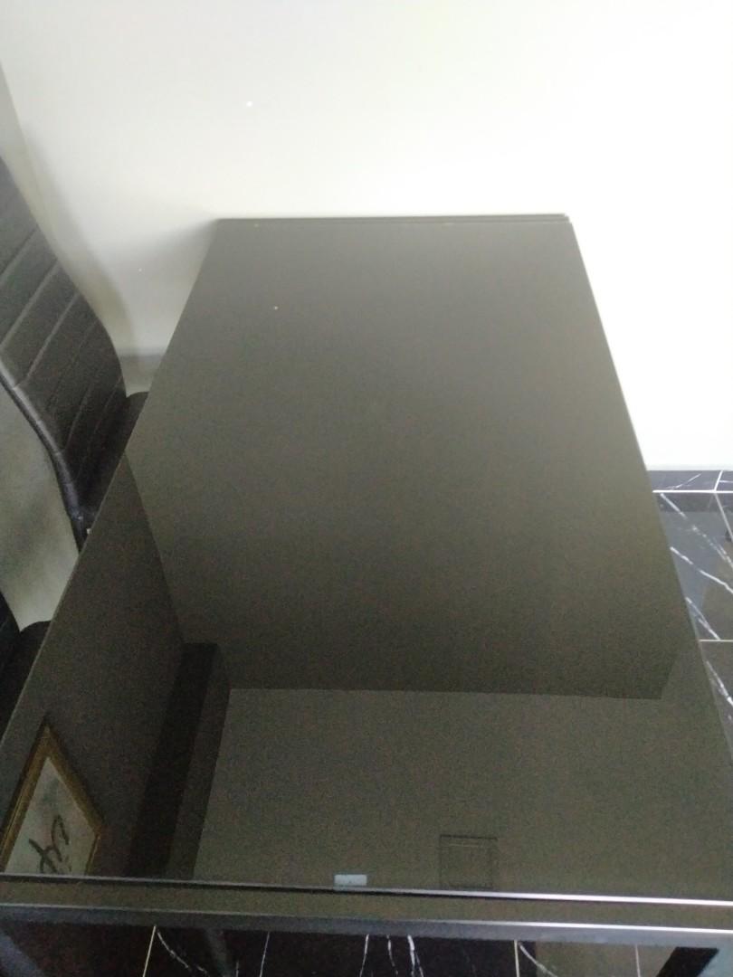 Dining table (Category: Tables & Sets) located in Singapore. Submitted by lanaimperio (Listing ID 1157184856, Image 2). Description: Black Dining Table only still in good condition. Tampered glass Table condition 8/10 If want chair, can take also but the condition of the chair is 5-6/10 self collect at punggol arrange own transport.