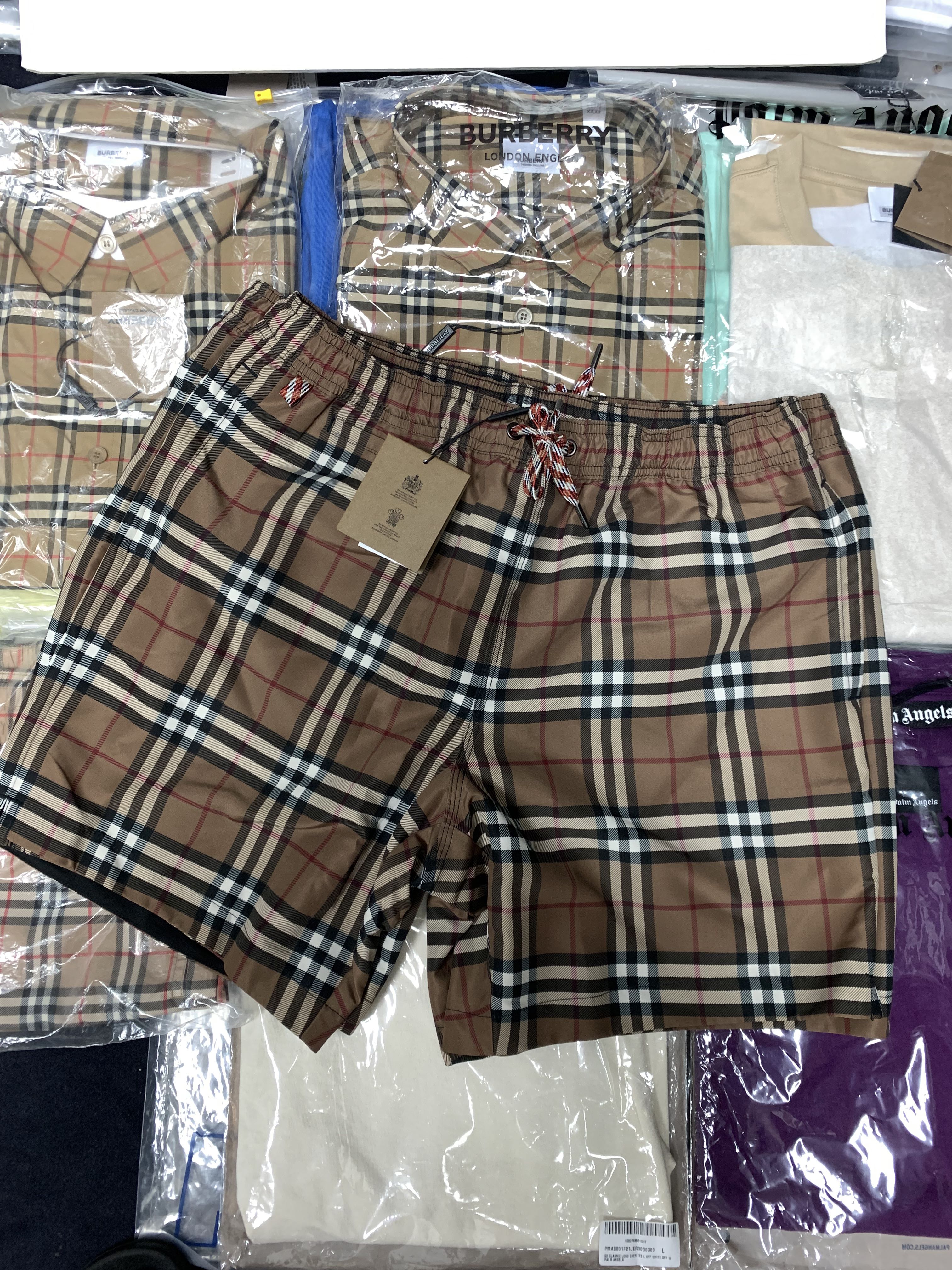 Authentic Instock Burberry Dark Brown Check Swim Shorts, Men's Fashion,  Bottoms, Shorts on Carousell