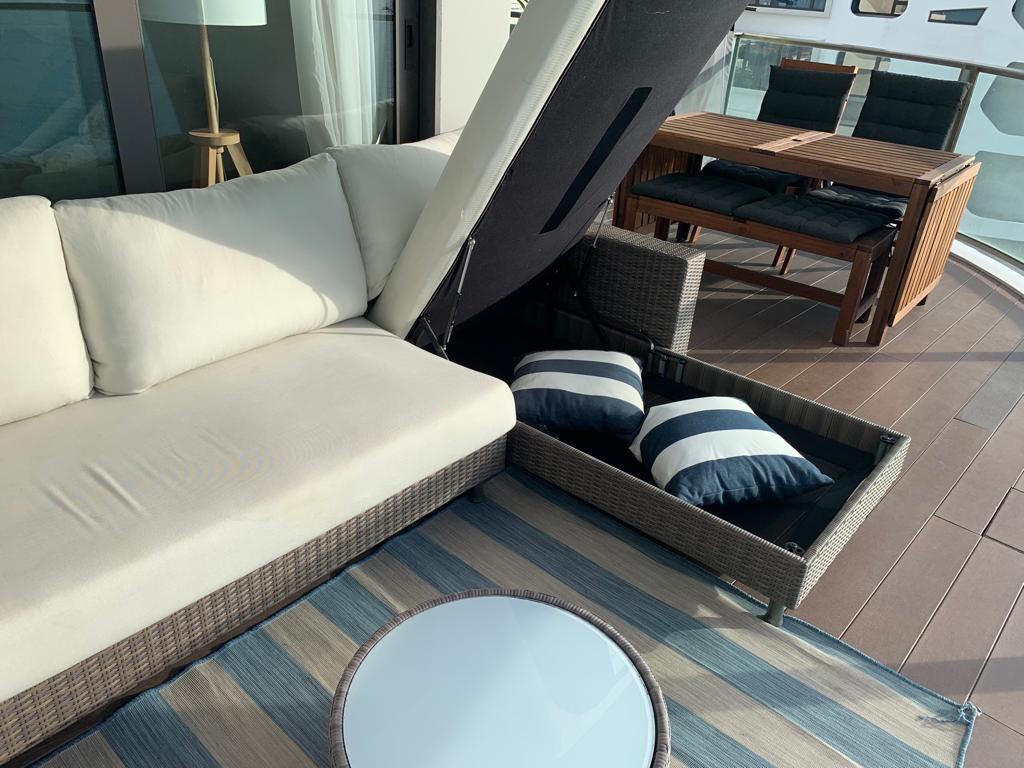 L shape outdoor sofa with chair, table and built in storage. King