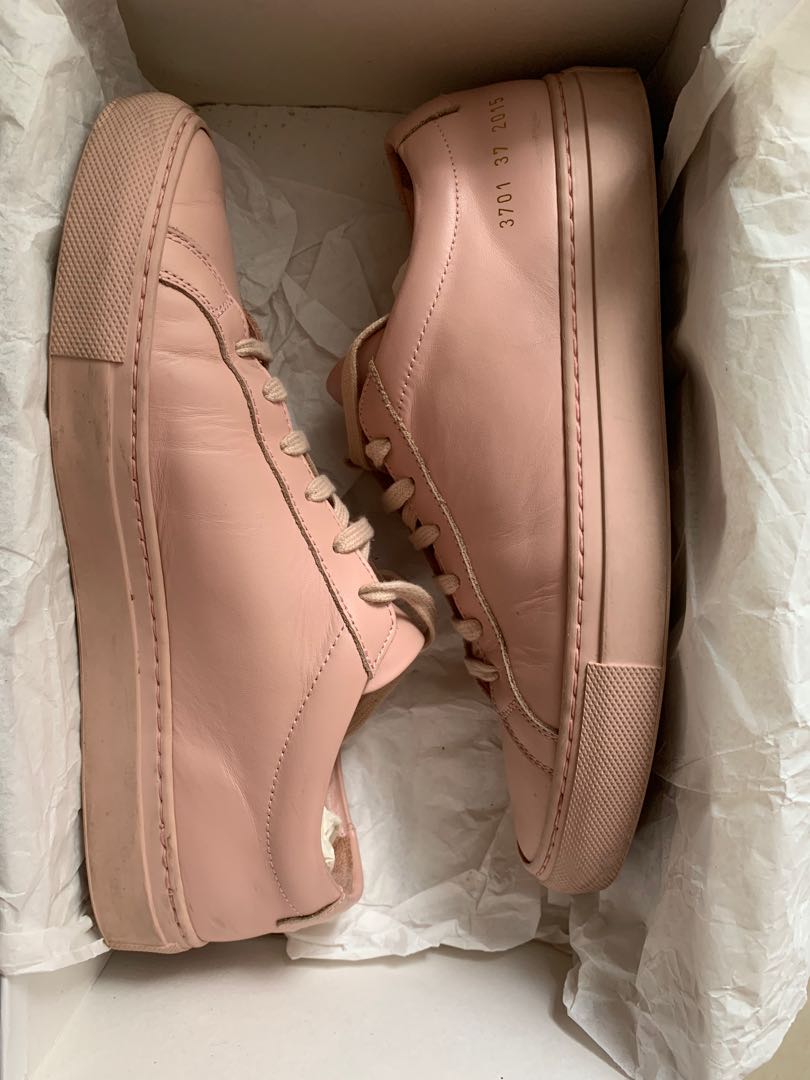 woman by common projects slip on