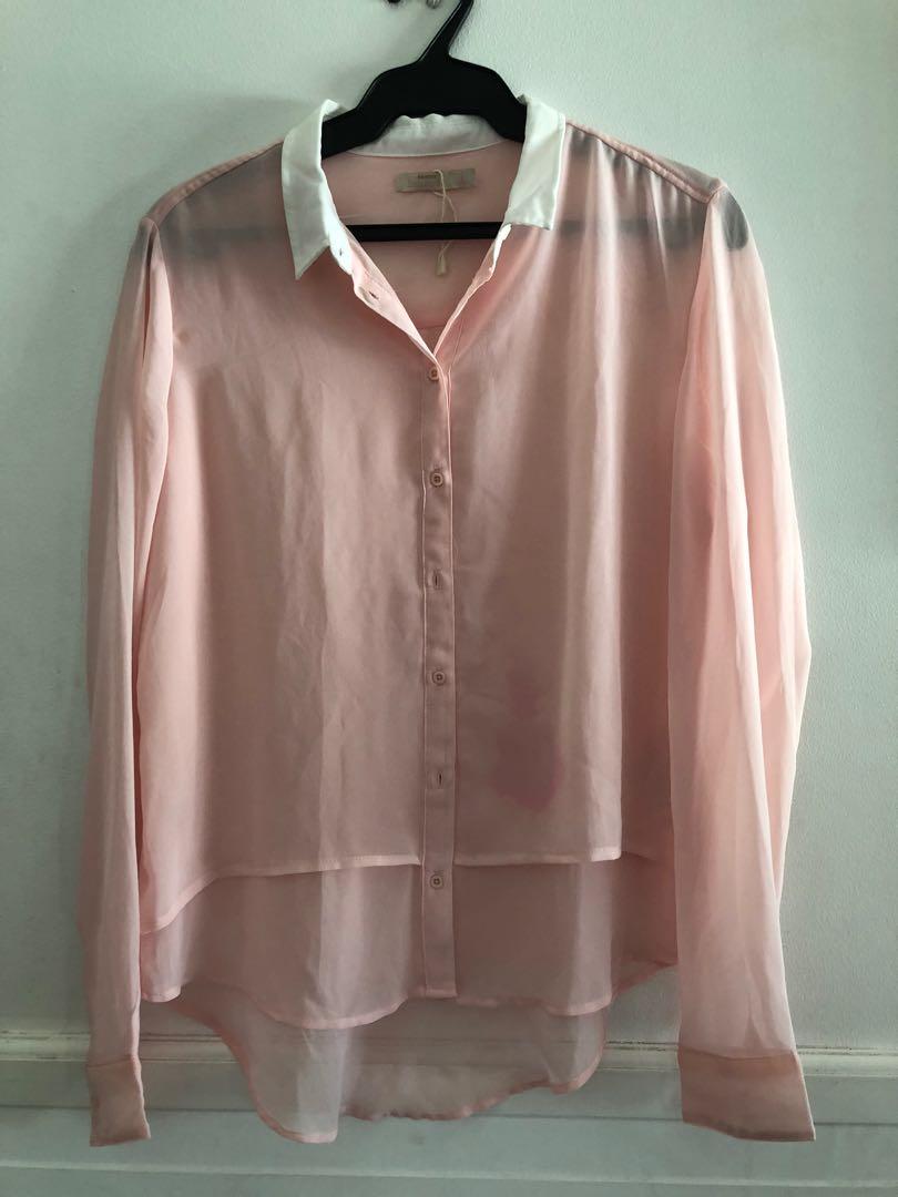 Bershka Sheer Pink Polo (Category: Longsleeves) located in Taguig. Submitted by declutteringthings0908 (Listing ID 1152982788, Image 1). Description: With damage as seen on photo. RFS: decluttering MOP: BPI, BDO, GCash.