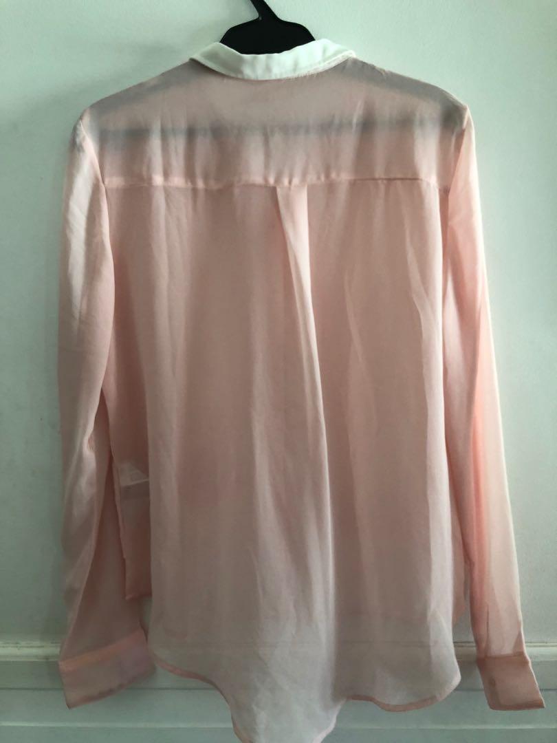 Bershka Sheer Pink Polo (Category: Longsleeves) located in Taguig. Submitted by declutteringthings0908 (Listing ID 1152982788, Image 2). Description: With damage as seen on photo. RFS: decluttering MOP: BPI, BDO, GCash.