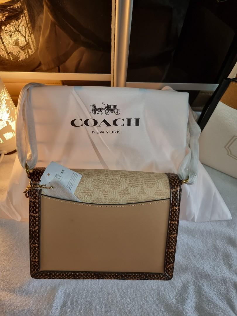 Hutton shoulder bag in blocked signature canvas with online snakeskin detail