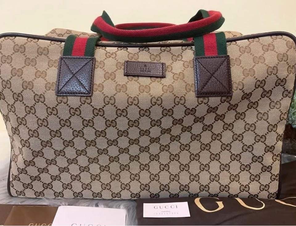Gucci luggage bag price on sale