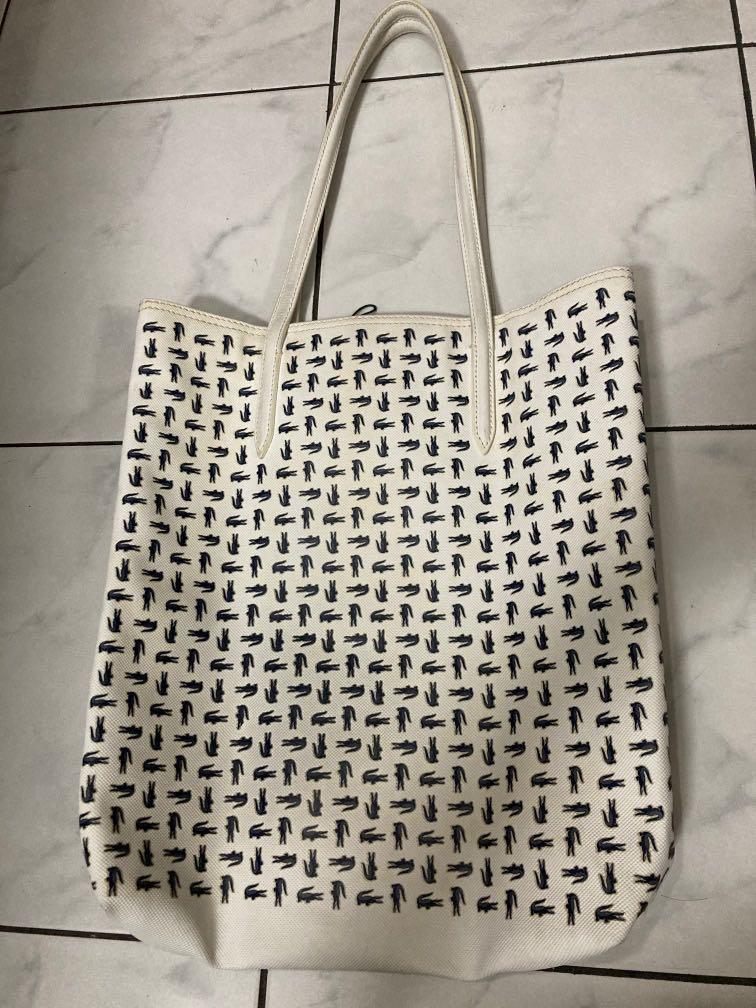 Lacoste Bag (Category: Luxury Bags & Wallets) located in Manila. Submitted by ljsaint (Listing ID 1153481973, Image 2). Description: 8.5/10 condition. Original lacoste bag. Twice lang nagamit. Sa tagal di nagamit nag color/stain na yung loob baka pwede malabhan then yung strap nya nagffade na yung color. Pero yung outside look nya ok na ok pa. 37cm length. 32cm width. 1300+shipping fee.