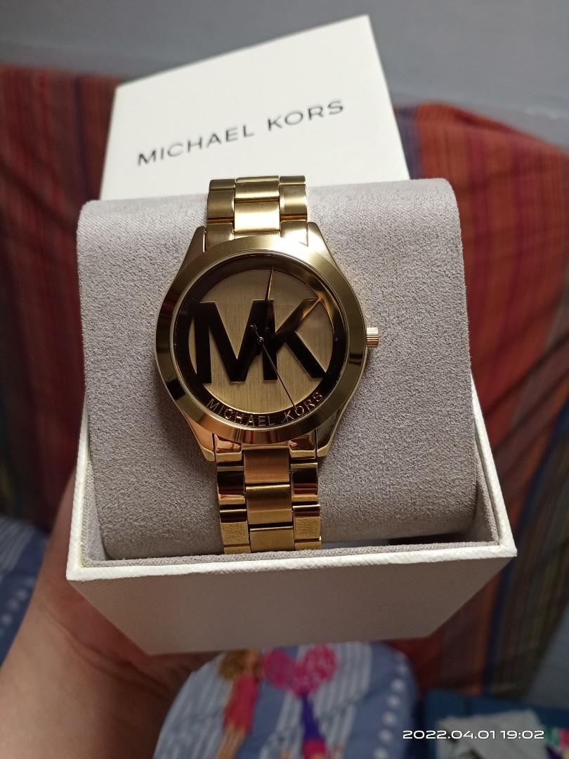 Mk big top face gold watch