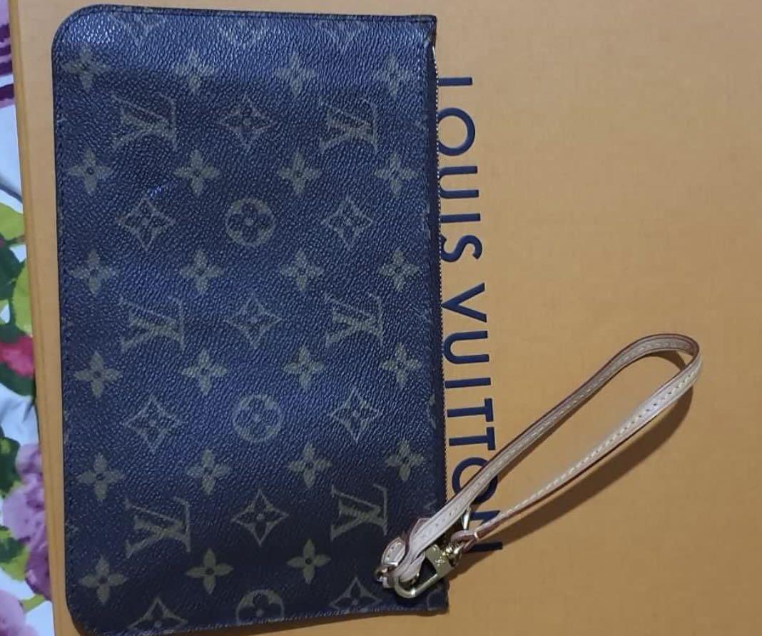 Authentic LV wristlet (Category: Luxury Bags & Wallets) located in Manila. Submitted by bornthisway22 (Listing ID 1153583427, Image 3). Description: authentic LV pouch wristlet wallet 100% original from u.s with serial code Almost new Box not included.