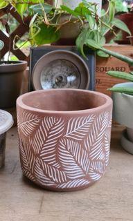 Brown planter with leaf motif