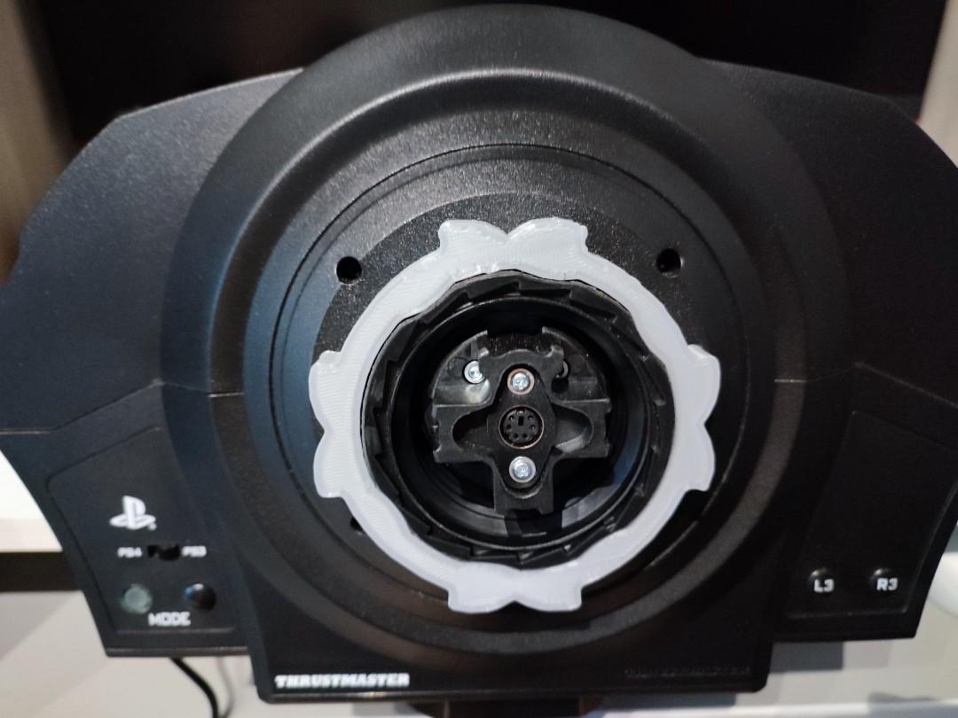 Thrustmaster Quick Release adapter (Category: Controllers) located in Singapore. Submitted by potatoseller123 (Listing ID 1142625070, Image 2). Description: Updated design! Tired of needing a screwdriver to change wheels? Built to order. This adapter eliminates the need for the screw in the stock T300 quick release system. With the adapter, wheel changes can be done in a few seconds without any tools. Instructions: Line the grooves with the groov