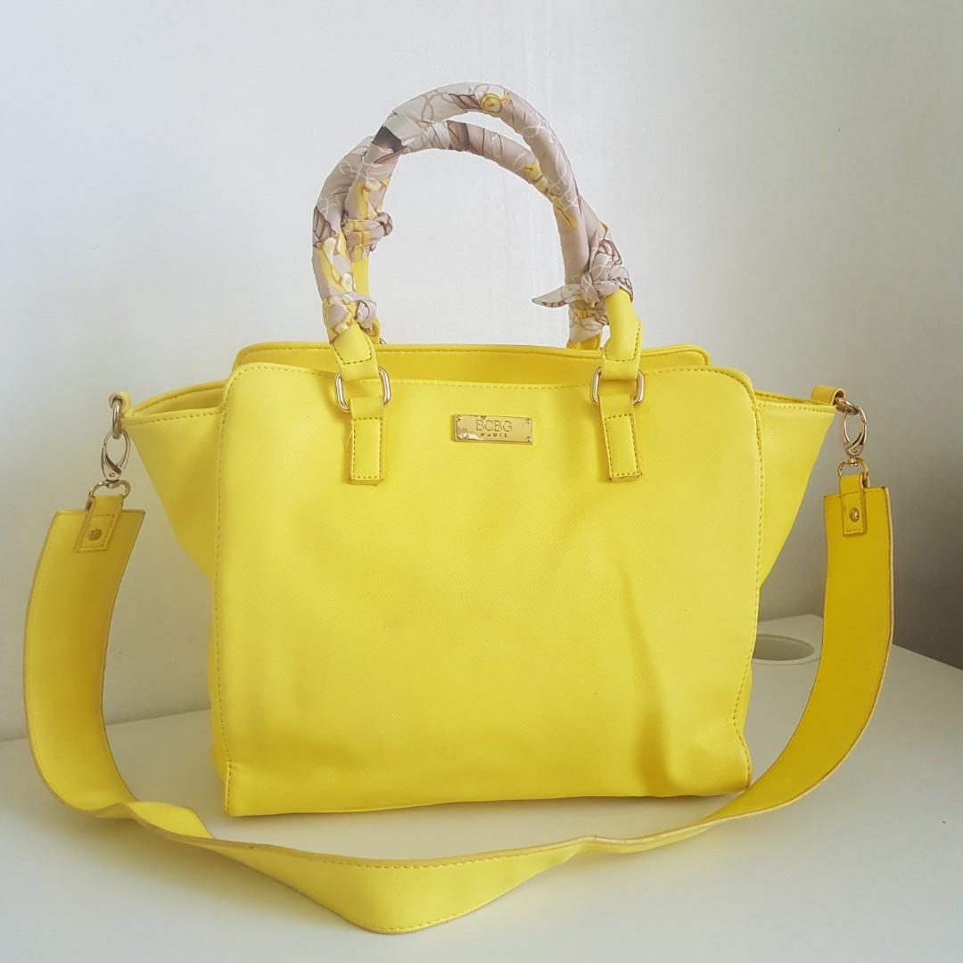 BCBG Yellow Leather Handbag (Category: Luxury Bags & Wallets) located in Quezon City. Submitted by maggieswardrobe (Listing ID 1158228611, Image 3). Description: --saffiano leather --detachable shoulder strap --all zippers in good condition --inner cloth lining is clean --issue: has a small brown spot in front (not sure if can be removed).