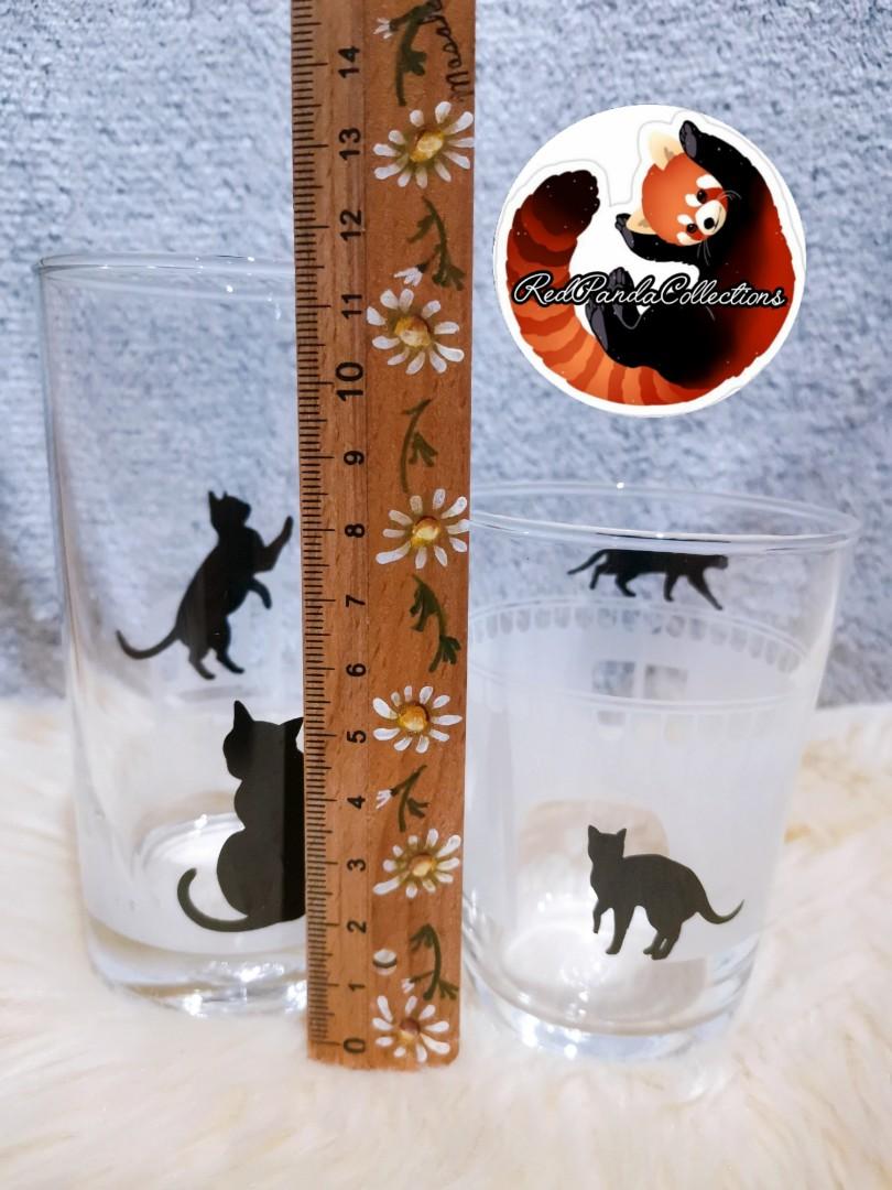 CAT DESIGNS - CAFE CHAT NOIR Drinking Glass SET (Category: Dinnerware & Cutlery) located in Davao. Submitted by redpandacollections (Listing ID 1159843654, Image 2). Description: CAT DESIGNS - CAFE CHAT NOIR SET Drinking Glass Clear Silhouette Style Brand OCEAN THAILAND Sizes see in the pictures provided Package Contains 2pcs Cat lovers will find this monotone coloured drinking glass with cat illustrations simply adorable. Perfect for serving ice