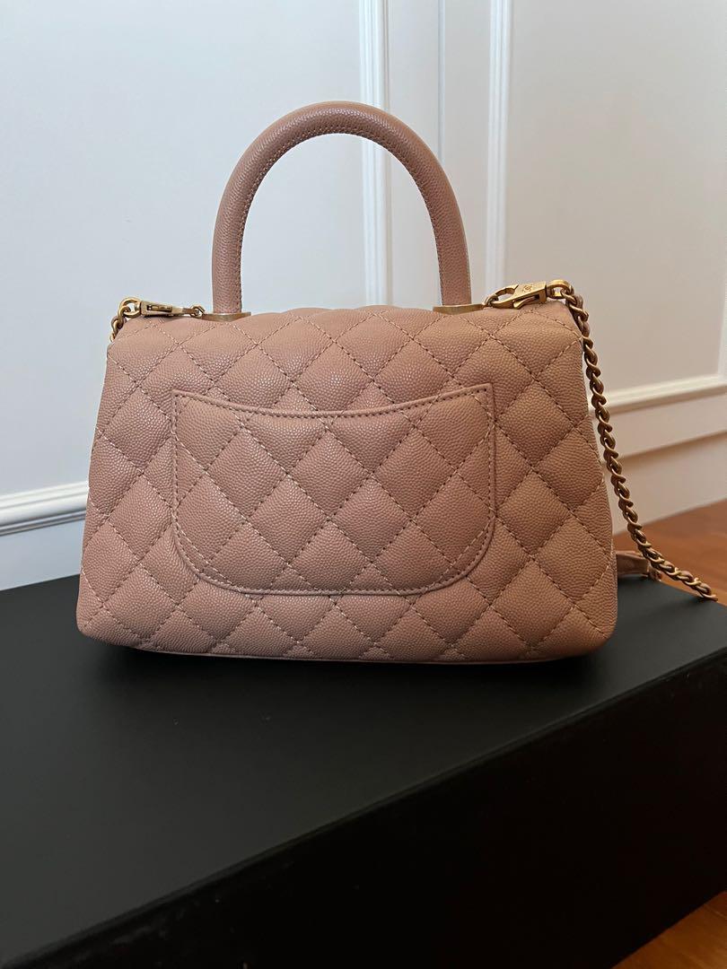 Chanel small coco handle 18s beige (Category: Bags & Wallets) located in Singapore. Submitted by semicharmed_ (Listing ID 1160166706, Image 3). Description: Beautiful 18s beige with aged gold hardware The perfect shade of beige with pink undertone Used lightly with minor signs of wear on right corner and base of handles due to attached chain. (Refer to photos) Still in great condition overall Not for fussies. Comes with box, dust bag and authenti