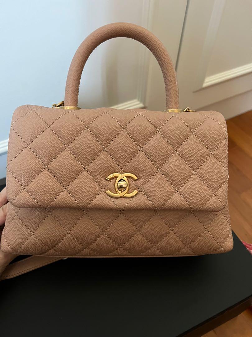 Chanel small coco handle 18s beige (Category: Bags & Wallets) located in Singapore. Submitted by semicharmed_ (Listing ID 1160166706, Image 2). Description: Beautiful 18s beige with aged gold hardware The perfect shade of beige with pink undertone Used lightly with minor signs of wear on right corner and base of handles due to attached chain. (Refer to photos) Still in great condition overall Not for fussies. Comes with box, dust bag and authenti