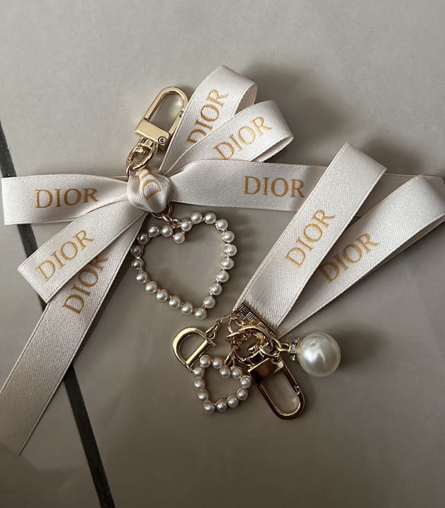 Dior keychain each one Luxury Accessories on Carousell