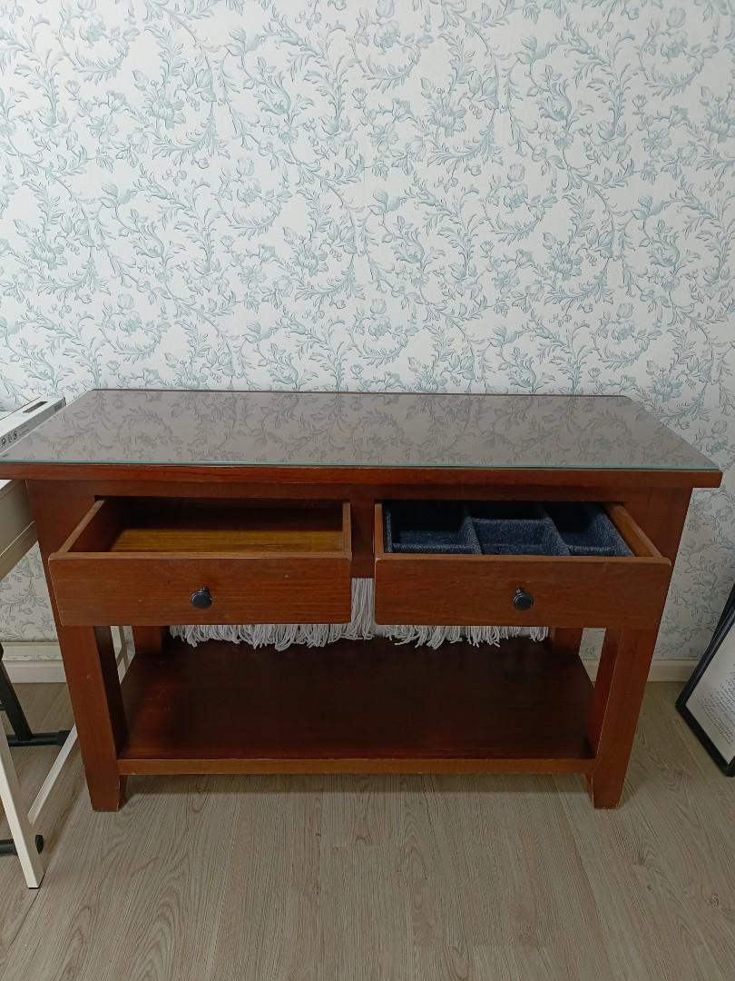 Study or Dressing Table (Category: Tables & Sets) located in Singapore. Submitted by sukiduck (Listing ID 1160187496, Image 1). Description: 120 cm (L) x 45 cm (B) x 81 cm (H). Solid wood console table from Picket & Rail. Made a glass top for this. Price already low and is non-negotiable coz it is quality wood. The item is at Bukit Batok. Please arrange your transport to pick up the item. Thank you..