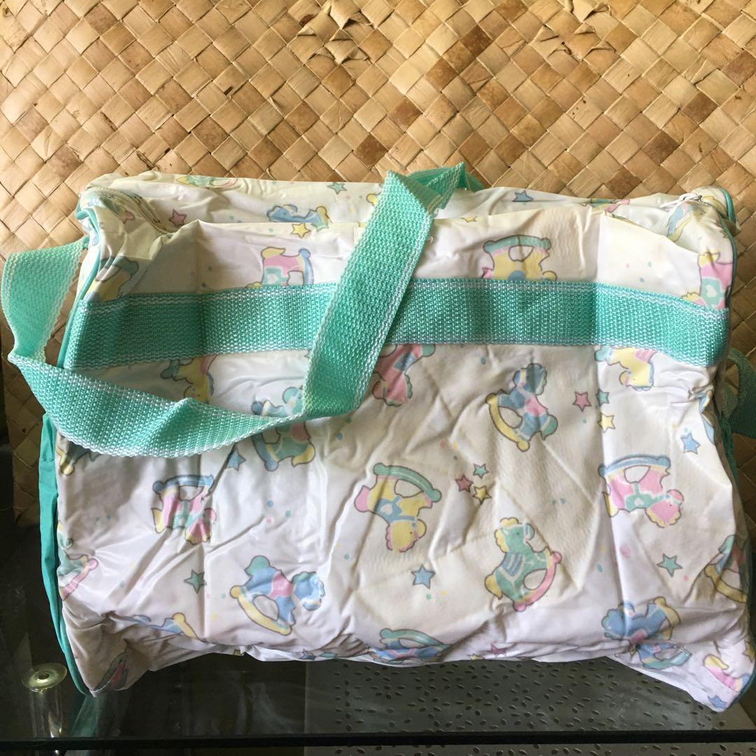 Green Baby Bag (Category: Other Babies Going Out Needs) located in Manila. Submitted by thebookclubz (Listing ID 1160399662, Image 2). Description: Baby diaper bag Has pockets for bottles Comes with a changing mat for changing outside .