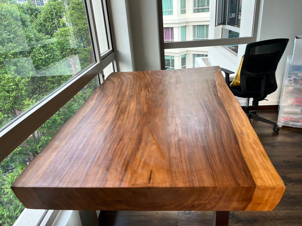 Solid Wood Table (Category: Tables & Sets) located in Singapore. Submitted by chloe589 (Listing ID 1160370678, Image 1). Description: Beautiful solid natural timber table with steel legs 83cm tall, 152 cm long. Breadth is 96 cm (at its widest) and 85 cm at its narrowest. Width a bit irregular because it’s natural timber (about 10cm) **there is a natural crack at one of the ends, picture in 8th slide Can be used as a dining table for 4 pax or a be