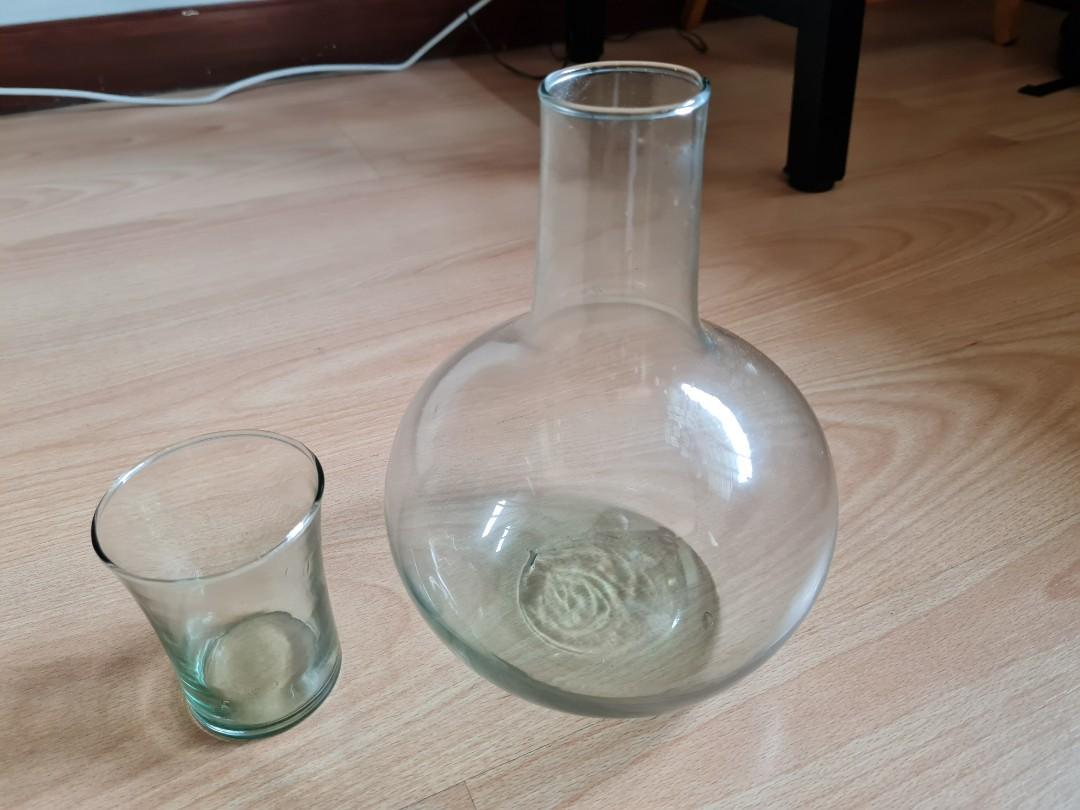 Carafe with glass (Category: Other Kitchenware & Tableware) located in Makati City. Submitted by kanixa (Listing ID 1160672087, Image 1). Description: height of carafe 9", height of glass 4". with box.carafe can also be used as a vase. RFS: decluttering.