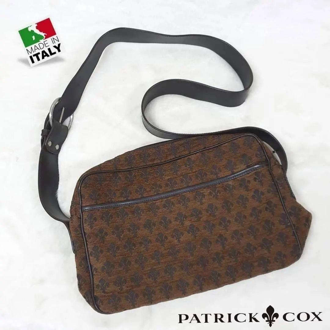 💯% Authentic PATRICK COX®️ Fleur-de-lis Monogram Messenger Bag | Made in 🇮🇹 ITALY (Category: Luxury Bags & Wallets) located in Mandaluyong City. Submitted by luxprelovedbagsparadise (Listing ID 1160917501, Image 1). Description: 💯% Authentic PATRICK COX®️ Fleur-de-lis Monogram Messenger Bag | Made in 🇮🇹 ITALY Patrick Cox is a British brand with a SOPHISTICATED design and beautiful functionality. The LOGO icon is the LILY “coat of arms” embl