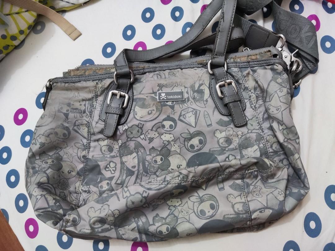 Tokidoki Medium Grey Messenger Bag (Category: Cross-body Bags) located in Quezon City. Submitted by crystynsya_ (Listing ID 1160923348, Image 1). Description: Yellow Discoloration and Leather is starting to crack. Please see photos. If you want more photos please leave a message.