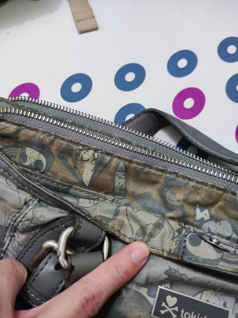 Tokidoki Medium Grey Messenger Bag (Category: Cross-body Bags) located in Quezon City. Submitted by crystynsya_ (Listing ID 1160923348, Image 2). Description: Yellow Discoloration and Leather is starting to crack. Please see photos. If you want more photos please leave a message.