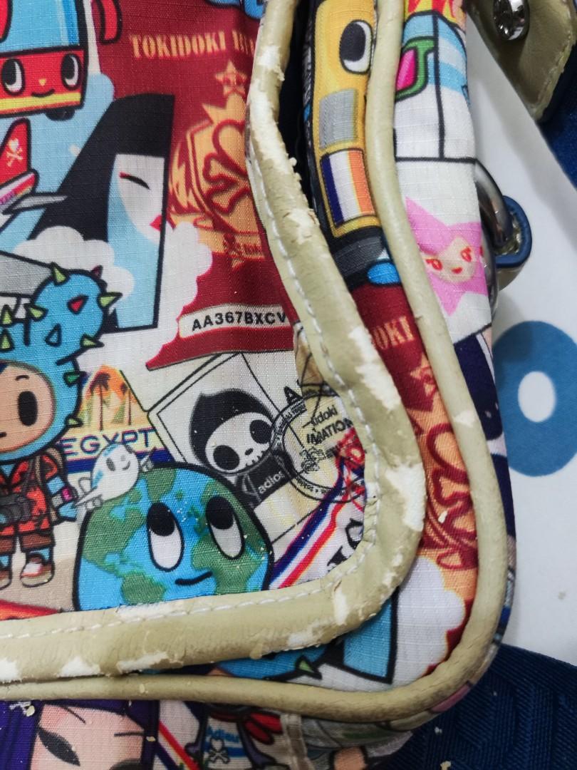 Tokidoki Small Messenger Bag (Category: Cross-body Bags) located in Quezon City. Submitted by crystynsya_ (Listing ID 1160922208, Image 2). Description: As seen on photo, leather is chipping off. If you want more photos, feel free to send a message.