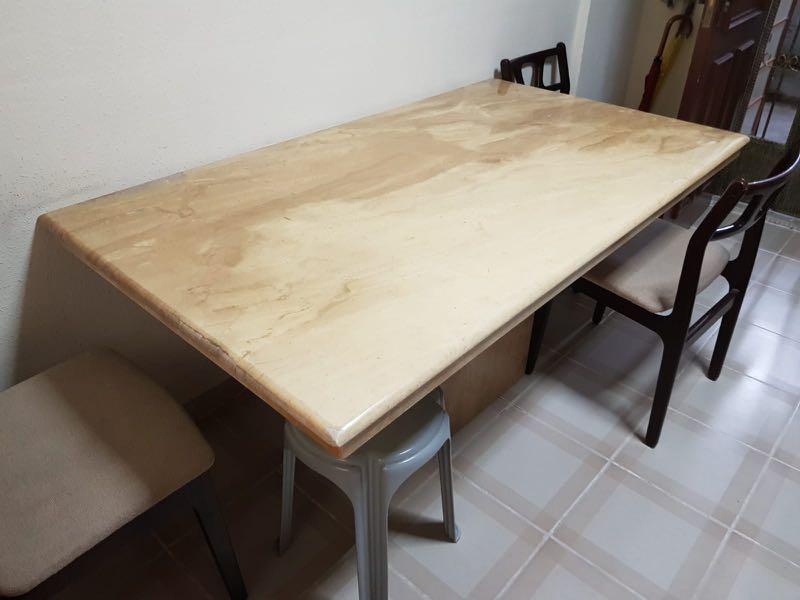 Marble dinning table (Category: Tables & Sets) located in Singapore. Submitted by windigo79 (Listing ID 1161219321, Image 1). Description: Very solid built and still very nice to view. Chipped at side and patch up with cement. Good for outdoor use. Please bring manpower to carry the top. At least 3-4 man. .