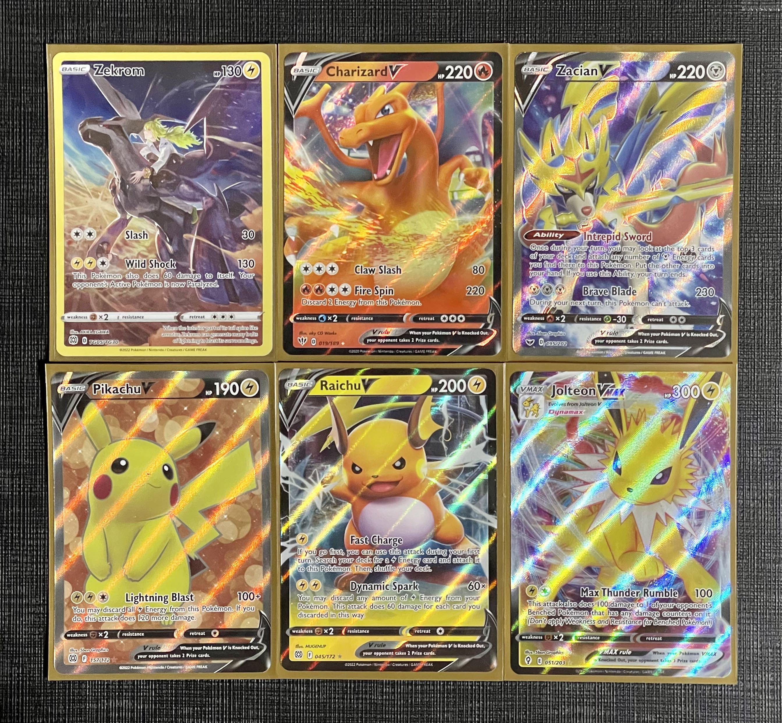 Pulled Talonflame V and Reshiram & Zekrom GX full art from an Aldi
