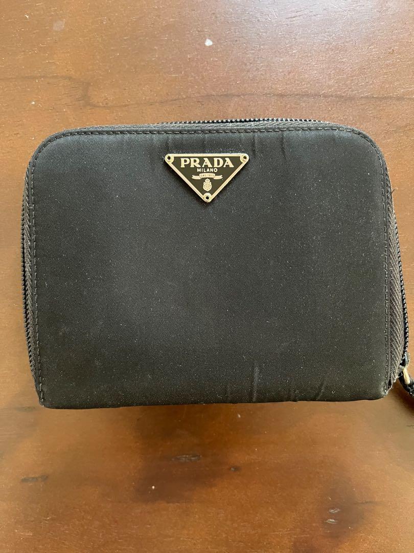 Prada wallet (Category: Luxury Bags & Wallets) located in Quezon City. Submitted by ejbumgen5678 (Listing ID 1161248870, Image 1). Description: Original legit prada preloved wallet Nylon Leather inside With coin slots With card slots and paper bills PRELOVED COSTS 7k up Selling very low Signs of use only on nylon on outside of wallet Leather inside is still super nice.