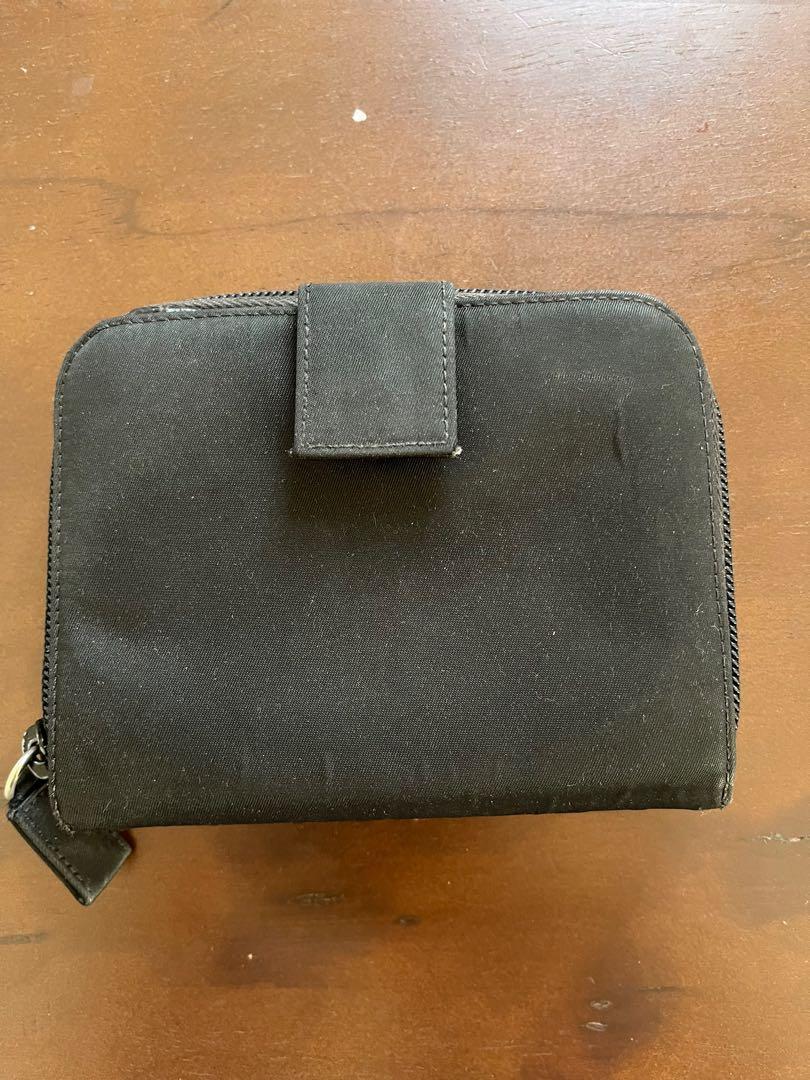Prada wallet (Category: Luxury Bags & Wallets) located in Quezon City. Submitted by ejbumgen5678 (Listing ID 1161248870, Image 2). Description: Original legit prada preloved wallet Nylon Leather inside With coin slots With card slots and paper bills PRELOVED COSTS 7k up Selling very low Signs of use only on nylon on outside of wallet Leather inside is still super nice.