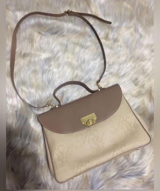 Authentic Nina Ricci kelly bag (Category: Luxury Bags & Wallets) located in Batangas. Submitted by girlmeetspurple (Listing ID 1161450453, Image 3). Description: Euc Nina ricci kelly style bag Comes with leather sling strap Guaranteed authentic bought from Japan.