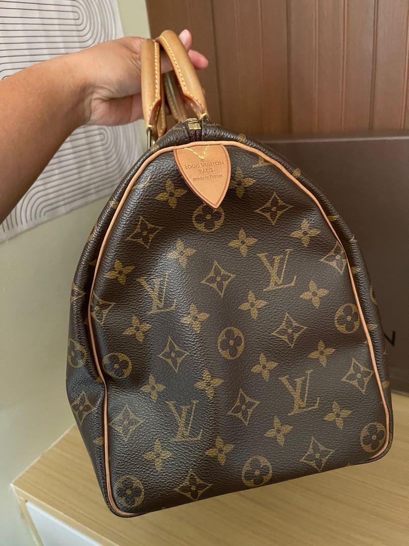 Authentic Louis Vuitton Speedy Monogram 35 (Category: Luxury Bags & Wallets) located in Dasmarinas. Submitted by excessmustg0 (Listing ID 1158442584, Image 3). Description: Guaranteed Authentic LV Speedy Monogram Size 35 Excellent Used Condition Still very nice, no cracks, no foul smell, no scratches and peeling. Very clean inside Only issue is it has hot stamp initials No lock and key but it comes with box, dustbag and receipt Directly Purchased