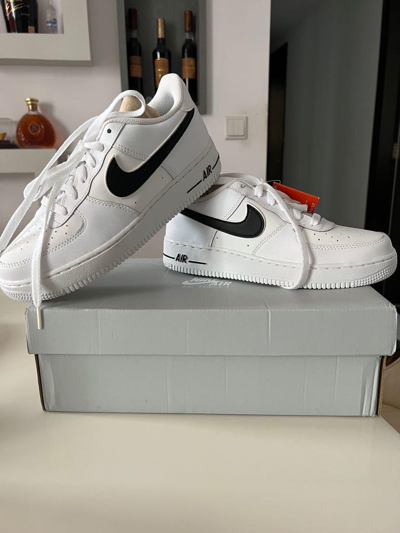 white air forces with small black tick