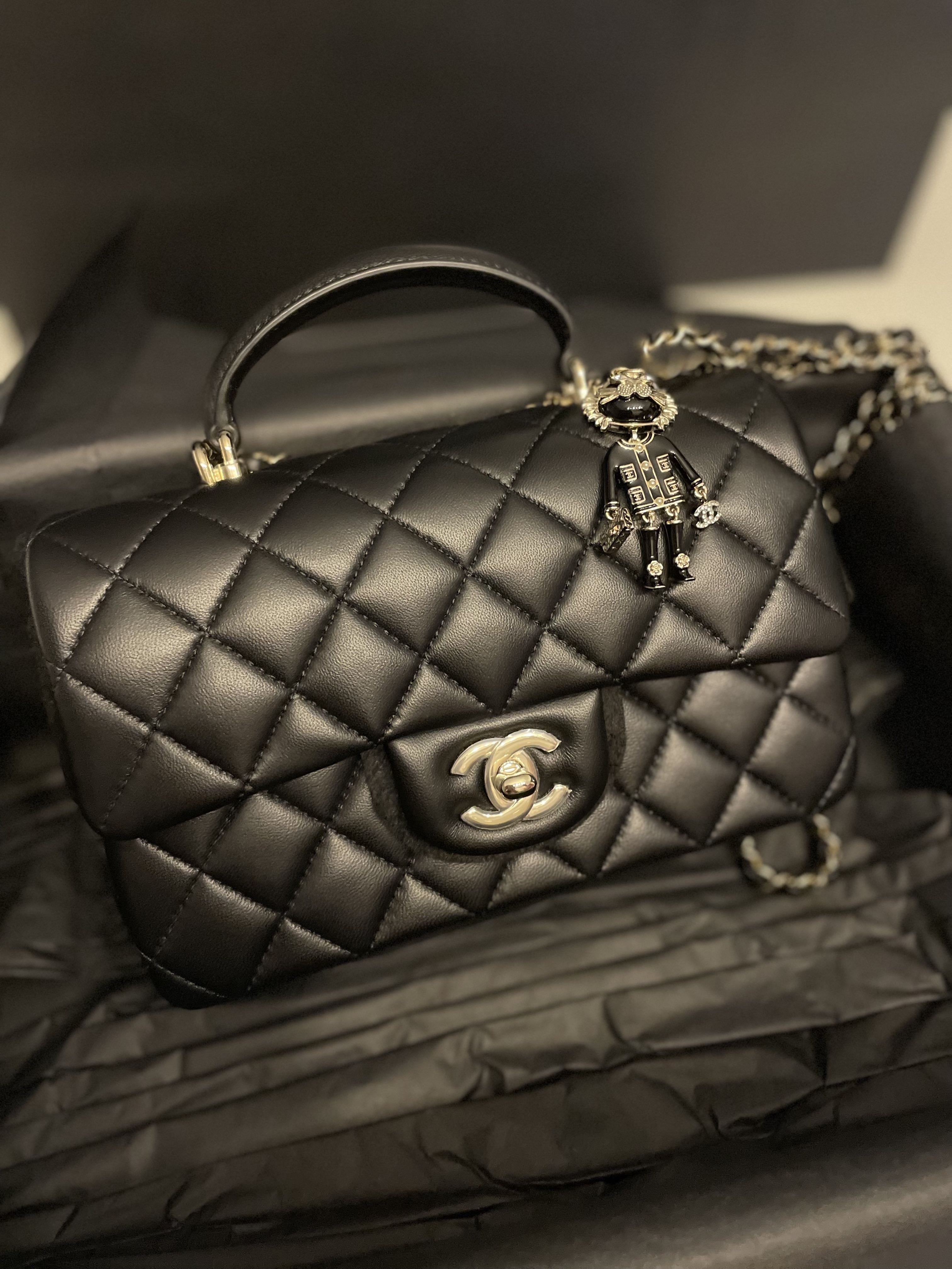 CHANEL Mini flap bag with top handle w coco chanel charm
