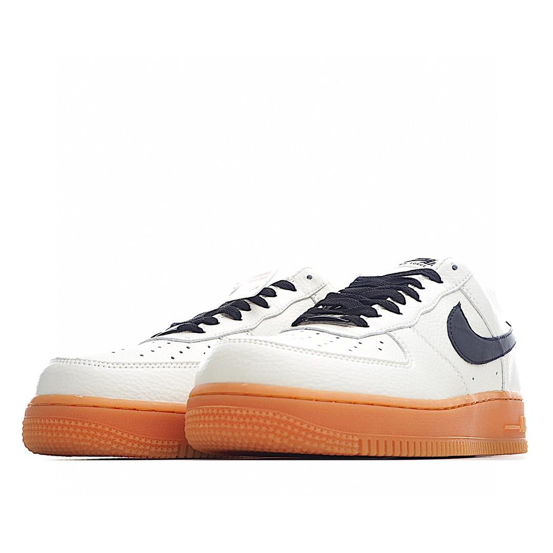 nike air force 1 trainers with navy swoosh and gum sole