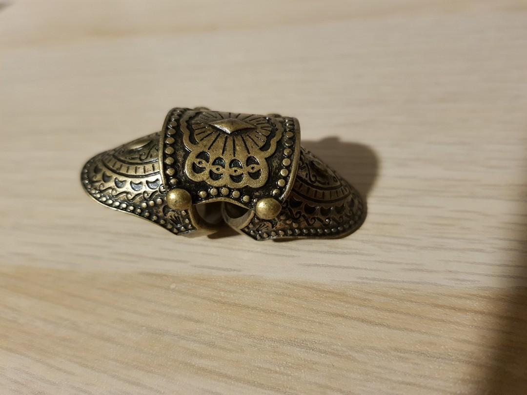 Bronze patterned ring (Category: Jewelry) located in Singapore. Submitted by glaaag (Listing ID 1162555597, Image 1). Description: Bought long ago and hardly used, kept in box since. Selling due to decluttering the house. Pls arrange own delivery or meetup, thanks! Ring holes 16mm - 17mm diameter..