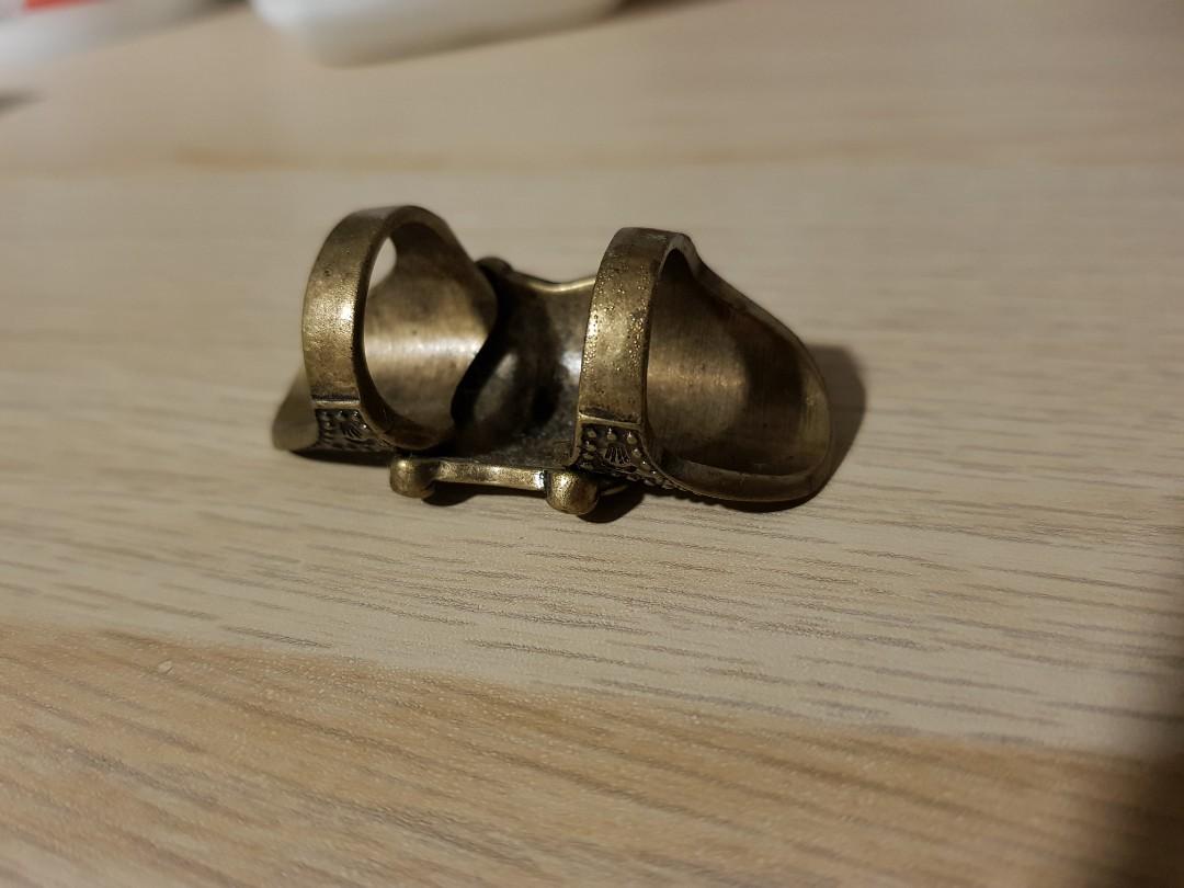 Bronze patterned ring (Category: Jewelry) located in Singapore. Submitted by glaaag (Listing ID 1162555597, Image 2). Description: Bought long ago and hardly used, kept in box since. Selling due to decluttering the house. Pls arrange own delivery or meetup, thanks! Ring holes 16mm - 17mm diameter..