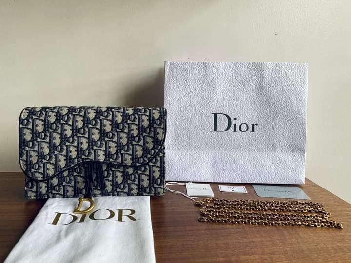 Dior Saddle Pouch Clutch On Chain (Category: Luxury Bags & Wallets) located in Manila. Submitted by bagislifeshop (Listing ID 1162592212, Image 1). Description: BRANDNEW DIOR SADDLE POUCH CLUTCH ON CHAIN Multi-Way Clutch w/ Removable Chain Classic Blue Oblique Jacquard Canvas Brassed Gold Tone Hardware Dimensions-8.5”x5.5”x1.5” Chain length: 120 cm / 47 inches 4 card slots 1 patch pocket 1 zipped pocket Middle Compartment Can Fit All iPhone Model