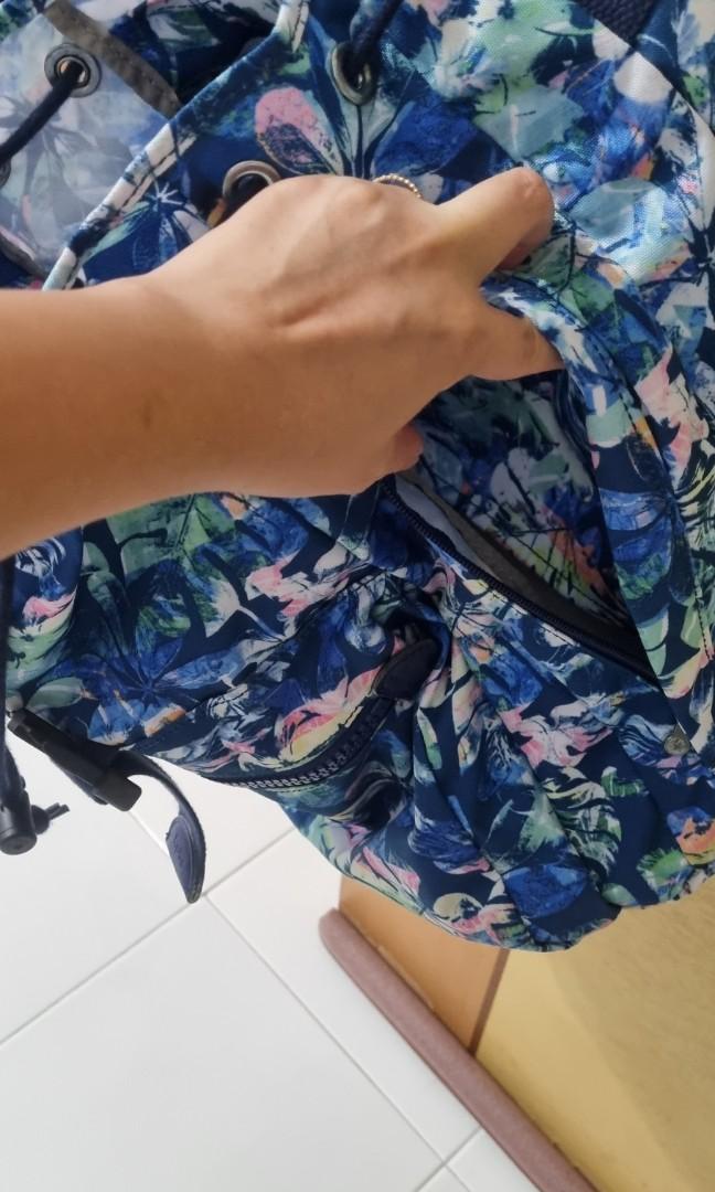 Kipling backpack (Category: Backpacks) located in Singapore. Submitted by hyc1988 (Listing ID 1162670714, Image 6). Description: excellent condition kipling backpack. drawstring with buckle flap and front zip compartment. main compartment has two large dividers and side zip for easy access..