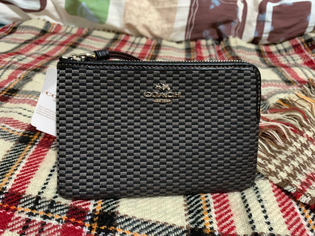 RUSH!! COACH Wristlet Authentic Unused Zipper Wristlet (Category: Luxury Bags & Wallets) located in Makati City. Submitted by zel_1801 (Listing ID 1162813568, Image 1). Description: RUSH for Sale COACH Wristlet Authentic Unused Legacy Jacquard Corner Zip Wristlet 💯 authentic Bought in Canada Inclusion: - Care Instructions - tag price $65cad - box rfs: relocating MOP: Gcash or bank transfer Price negotiable but no lowballer please .