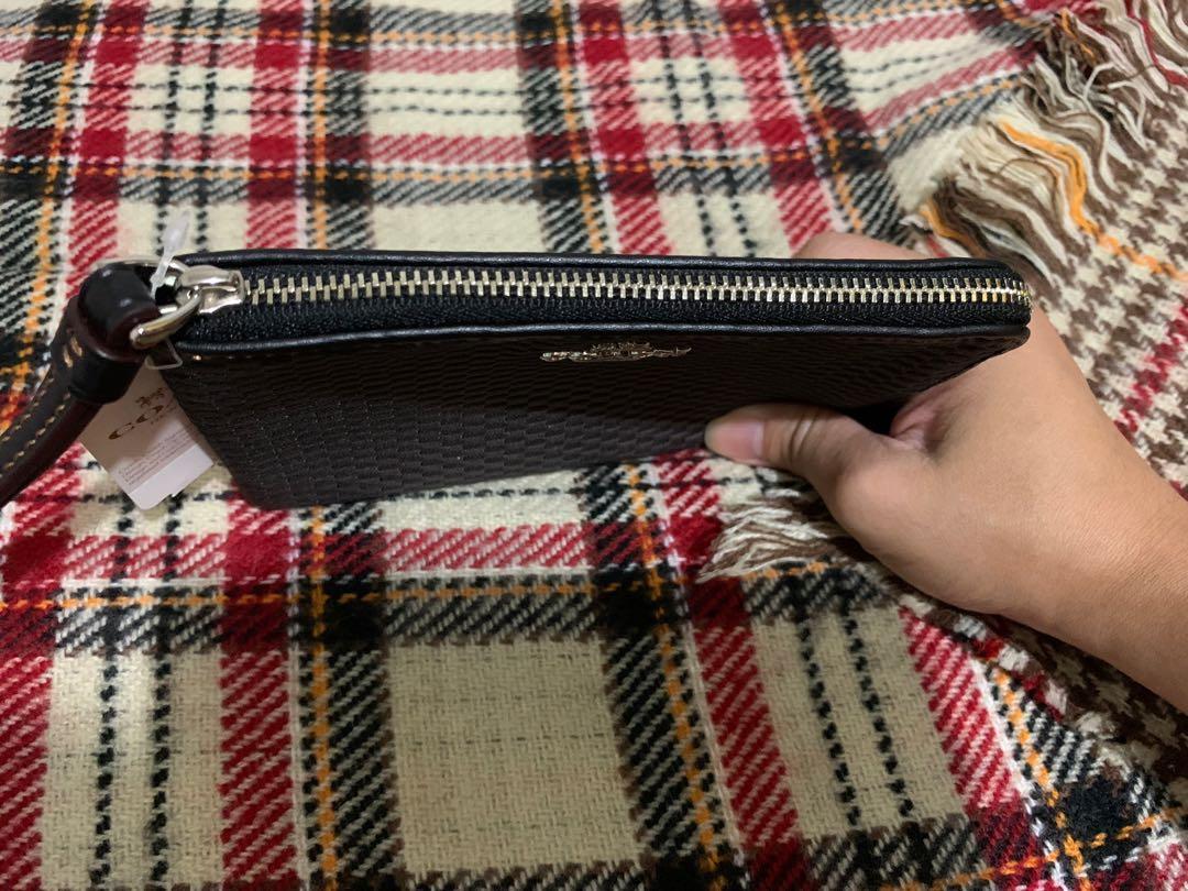 RUSH!! COACH Wristlet Authentic Unused Zipper Wristlet (Category: Luxury Bags & Wallets) located in Makati City. Submitted by zel_1801 (Listing ID 1162813568, Image 3). Description: RUSH for Sale COACH Wristlet Authentic Unused Legacy Jacquard Corner Zip Wristlet 💯 authentic Bought in Canada Inclusion: - Care Instructions - tag price $65cad - box rfs: relocating MOP: Gcash or bank transfer Price negotiable but no lowballer please .