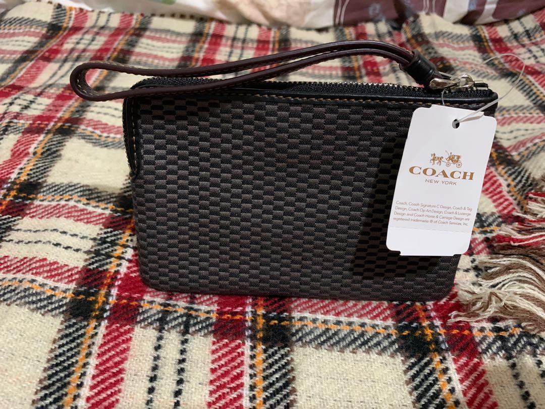 RUSH!! COACH Wristlet Authentic Unused Zipper Wristlet (Category: Luxury Bags & Wallets) located in Makati City. Submitted by zel_1801 (Listing ID 1162813568, Image 2). Description: RUSH for Sale COACH Wristlet Authentic Unused Legacy Jacquard Corner Zip Wristlet 💯 authentic Bought in Canada Inclusion: - Care Instructions - tag price $65cad - box rfs: relocating MOP: Gcash or bank transfer Price negotiable but no lowballer please .