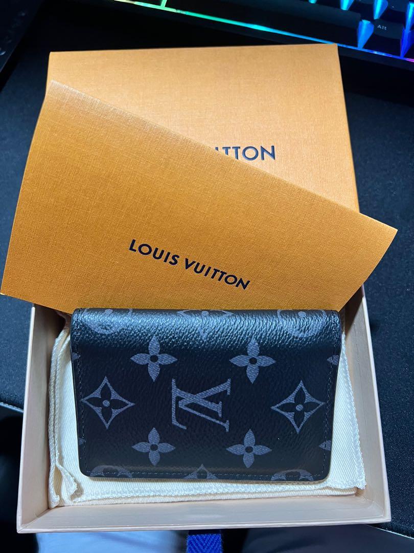 louis-vuitton pocket organizer black with blue lining. Practically unused.