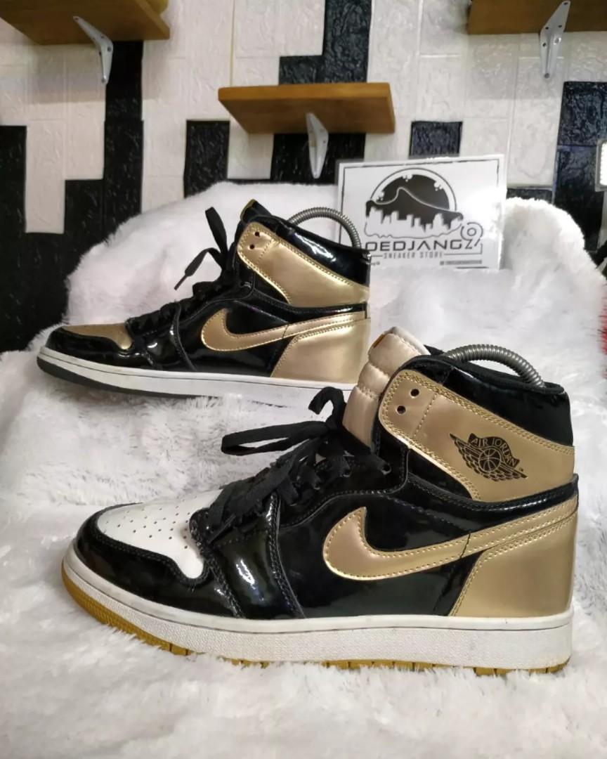 gold and black and white jordan 1