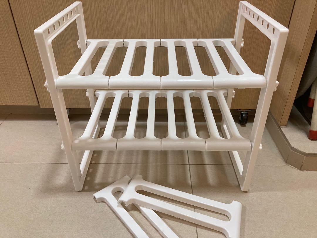 Two layered rack (Category: Outdoor Furniture) located in Singapore. Submitted by all.things.must.go_store (Listing ID 1162903821, Image 1). Description: Two layered extendable rack Height: 37.5 cm Depth: 25.5 cm Length: 37-60 cm Condition: Opened but unused .