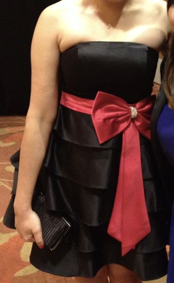 Black dress with red outlet ribbon