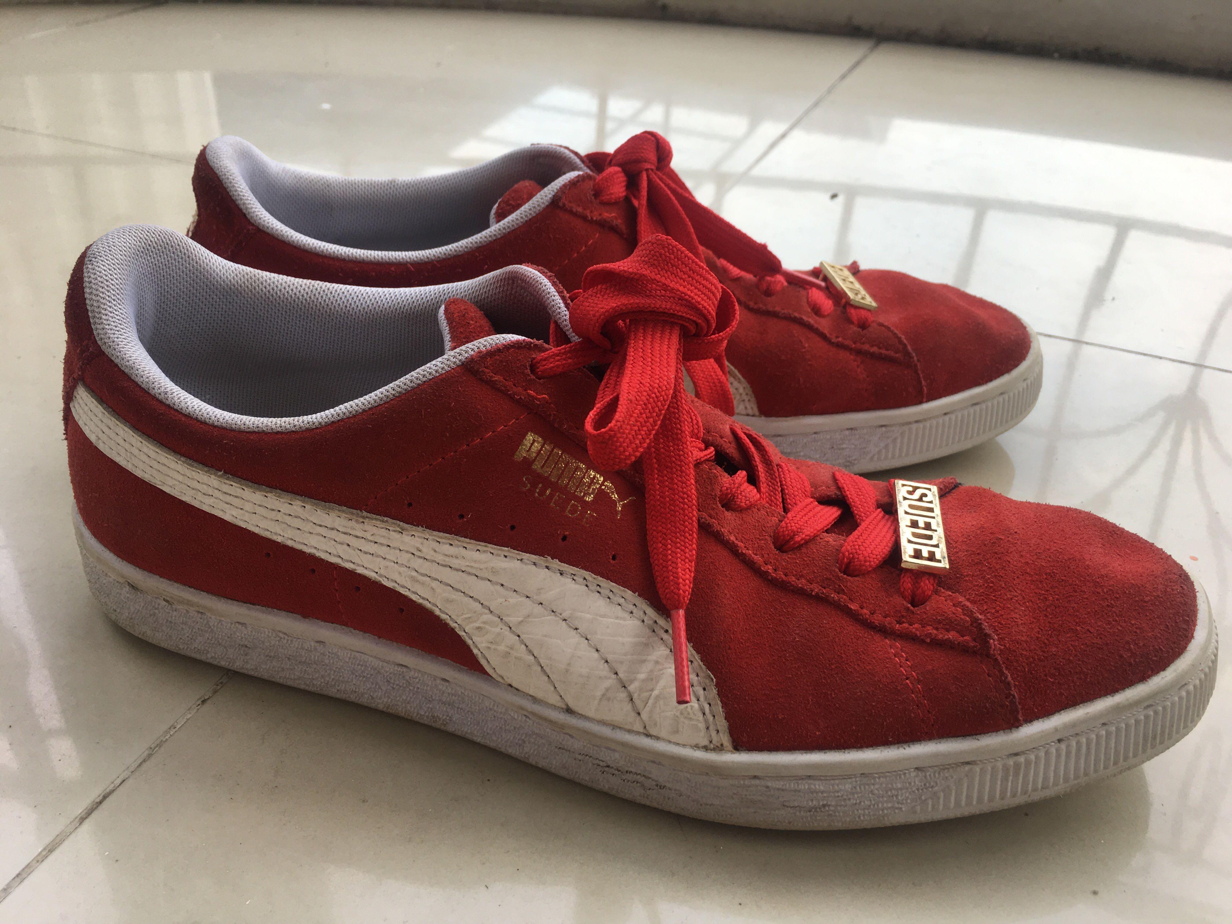 red and white suede pumas