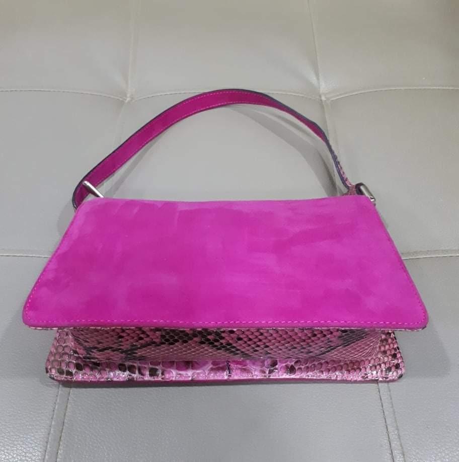 Saks Fifth Avenue Pochette Type (Category: Luxury Bags & Wallets) located in Taguig. Submitted by esa.agustin (Listing ID 1163380050, Image 2). Description: Original Saks Fifth Avenue pink pochette type handbag. Body is a combination of snake skin and gamuza. Made in Italy..