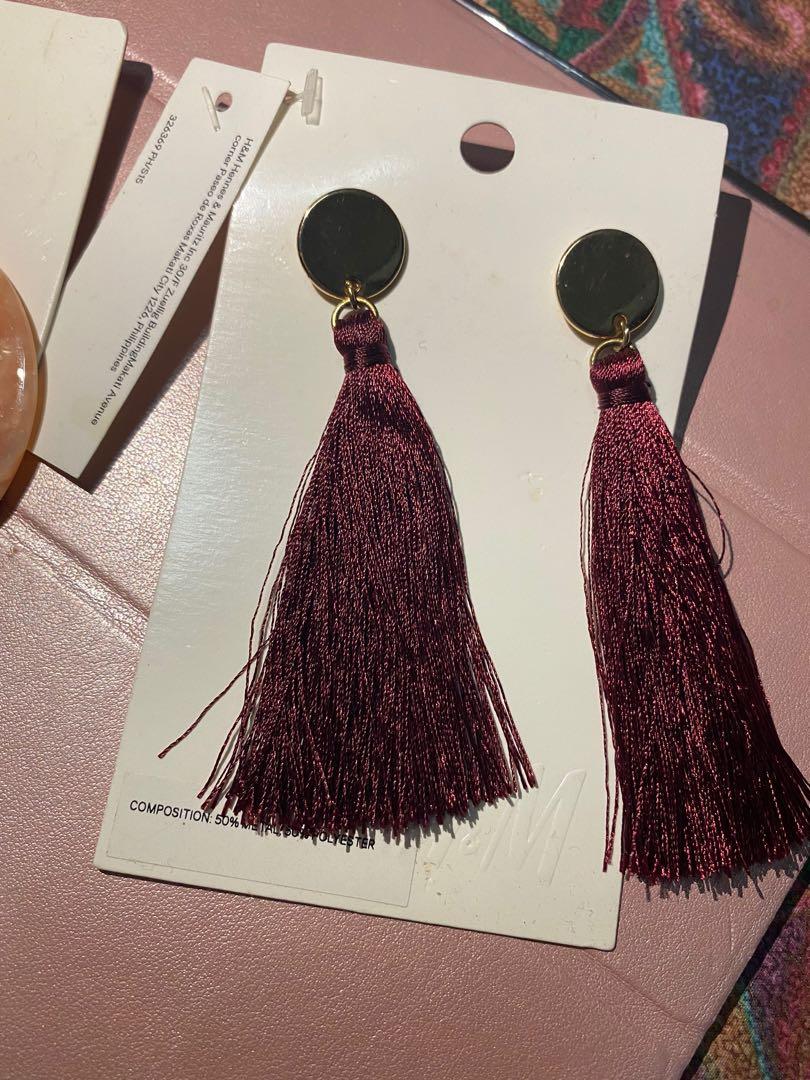 Statement Earrings (Category: Other Accessories) located in Mandaluyong City. Submitted by plmae (Listing ID 1163473552, Image 2). Description: 2 for Php300 Brand: H&M (red tassel) F21 ( Round blush Marble) .
