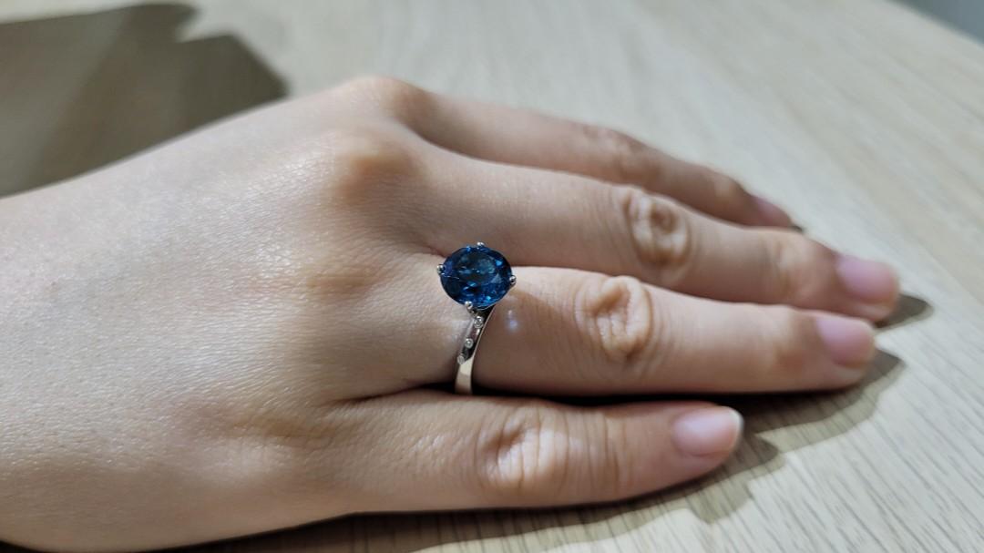 White gold ring with blue topaz store